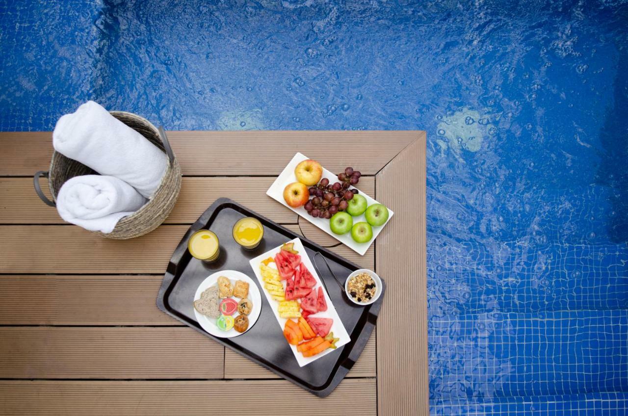 Quo Quality Hotel Manizales Exterior foto A poolside snack